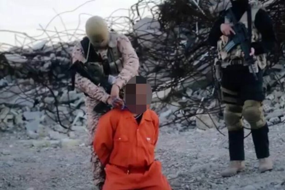 Zgarda exploziva - ultima metoda socanta de executie a ISIS. Teroristii au facut publica filmarea - Imaginea 1