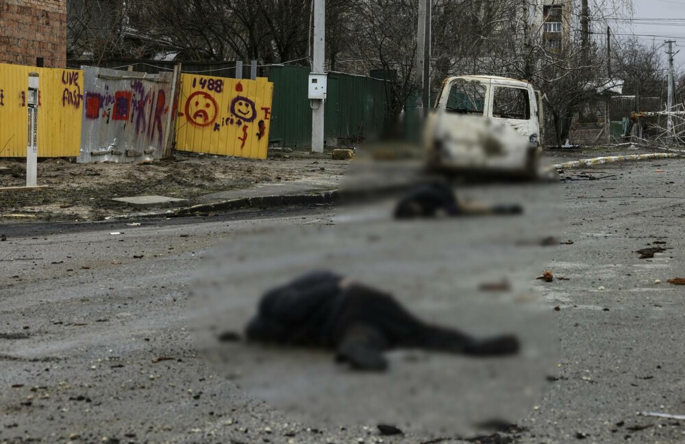 FOTO Cel puţin 20 de cadavre zăceau pe o stradă din Bucea, oraş recent eliberat din apropiere de Kiev - Imaginea 7