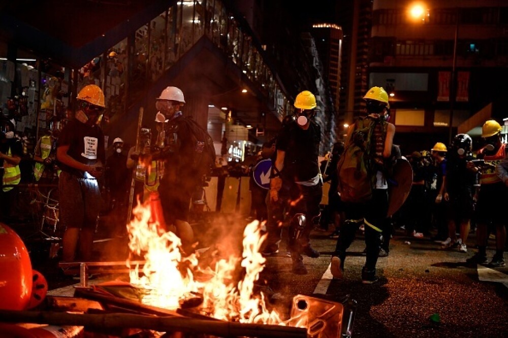 Proteste în Hong Kong. Poliția a folosit gaze lacrimogene împotriva manifestanților - Imaginea 11