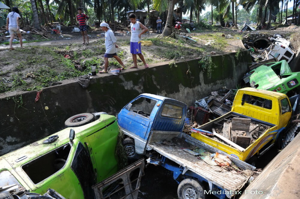Bilantul furtunii tropicale din Filipine depaseste o mie de morti. GALERIE FOTO - Imaginea 1