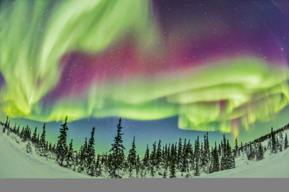 Orășelul unde se vede aurora boreală 300 de nopți pe an. Ce îl face locul perfect pentru a vedea spectacolul celest - Imaginea 1