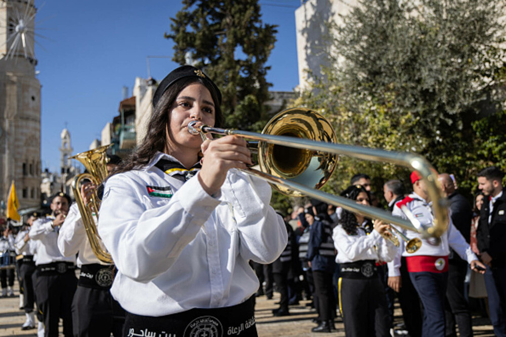 Primul Crăciun în Betleem după doi ani de război în Gaza: parade, colinde și tradiții reluate în umbra crizei umanitare. FOTO - Imaginea 14