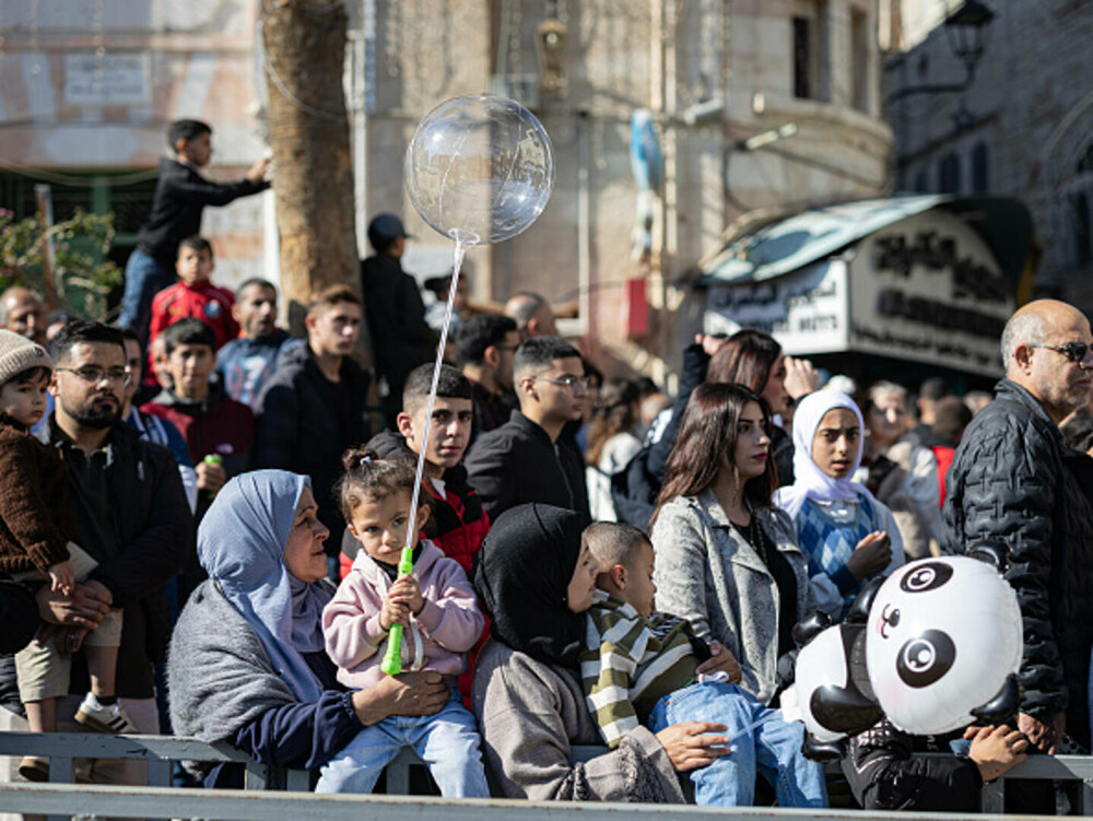 Primul Crăciun în Betleem după doi ani de război în Gaza: parade, colinde și tradiții reluate în umbra crizei umanitare. FOTO - Imaginea 25