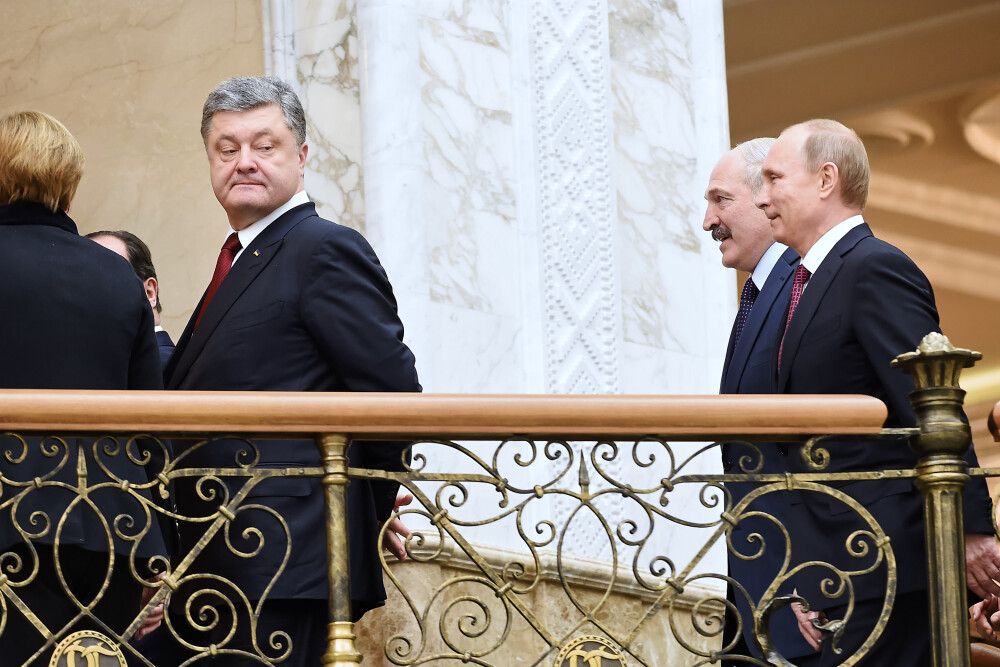 Momentele cheie ale summit-ului de la MINSK in imagini. De la presupusul creion rupt de Putin la dialoguri tensionate - Imaginea 1