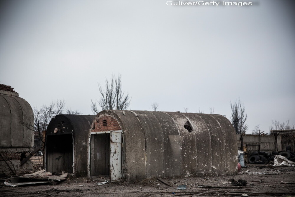 Apocalipsa din estul Ucrainei. Peisajul dezolant din Donetk aduce aminte de sfarsitul celui de-Al Doilea Razboi Mondial. FOTO - Imaginea 11