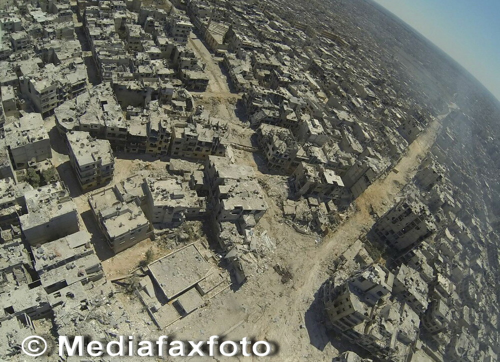 Dimensiunea distrugerilor din al treilea oras sirian ca marime: imagini apocaliptice din Homs - Imaginea 5