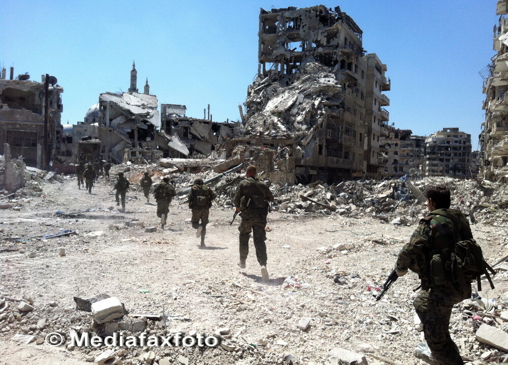 Dimensiunea distrugerilor din al treilea oras sirian ca marime: imagini apocaliptice din Homs - Imaginea 2