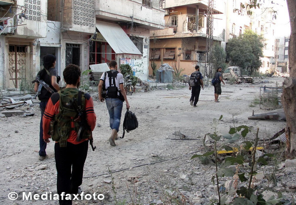 Dimensiunea distrugerilor din al treilea oras sirian ca marime: imagini apocaliptice din Homs - Imaginea 1