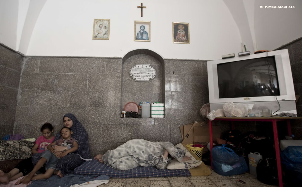O zi in iadul din Fasia Gaza. Musulmanii ingroziti, civili nevinovati, se ascund in biserici ca sa scape de moarte. FOTO - Imaginea 1