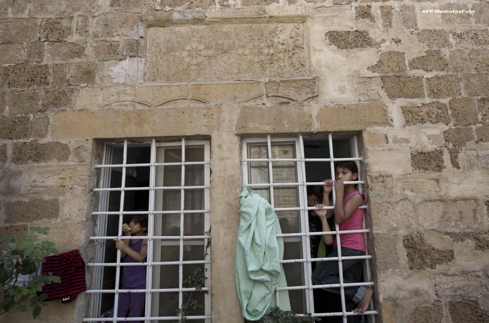 O zi in iadul din Fasia Gaza. Musulmanii ingroziti, civili nevinovati, se ascund in biserici ca sa scape de moarte. FOTO - Imaginea 3