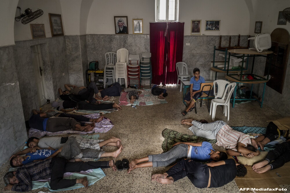 O zi in iadul din Fasia Gaza. Musulmanii ingroziti, civili nevinovati, se ascund in biserici ca sa scape de moarte. FOTO - Imaginea 4