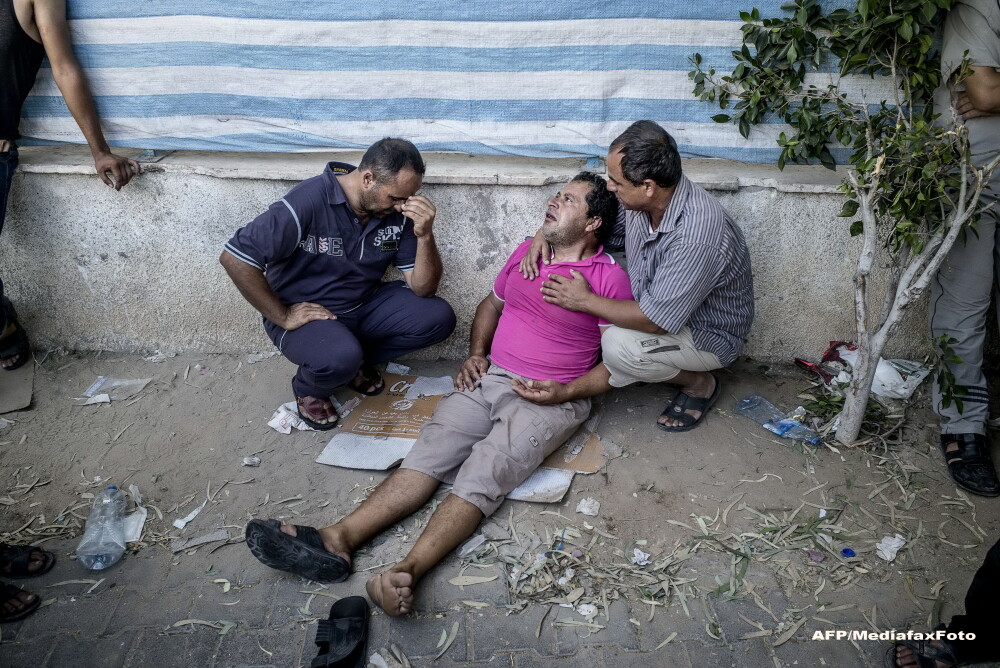 O zi in iadul din Fasia Gaza. Musulmanii ingroziti, civili nevinovati, se ascund in biserici ca sa scape de moarte. FOTO - Imaginea 8