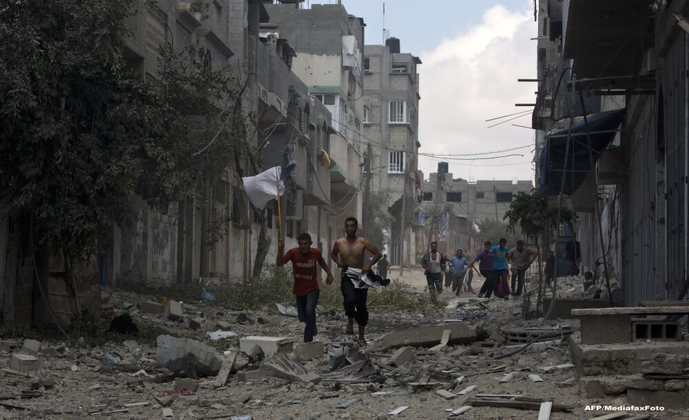 O zi in iadul din Fasia Gaza. Musulmanii ingroziti, civili nevinovati, se ascund in biserici ca sa scape de moarte. FOTO - Imaginea 9
