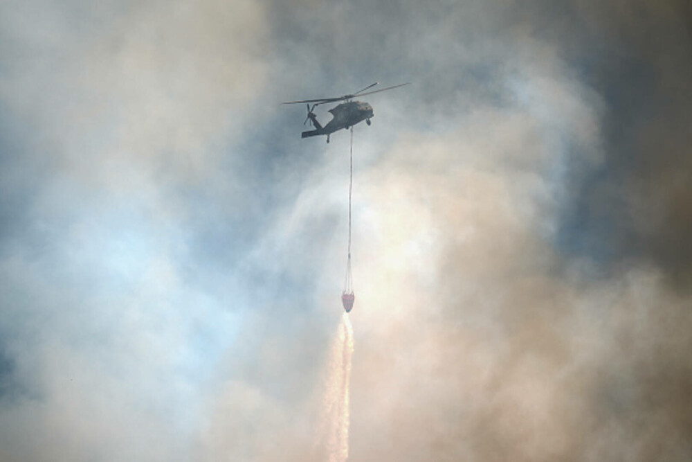 Turcia, împărțită între incendii de vegetaţie și ninsori. „E prima dacă când văd zăpadă în iulie”. GALERIE FOTO - Imaginea 16