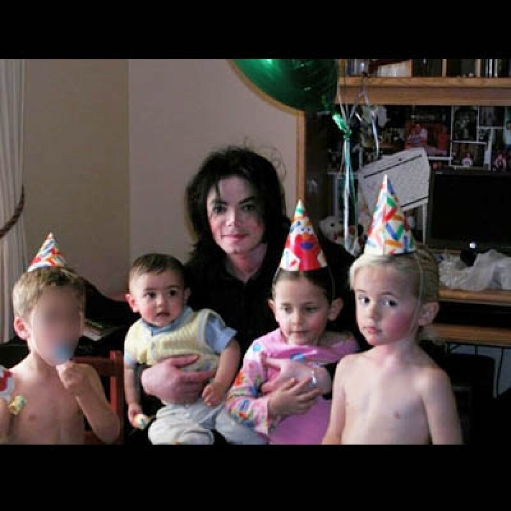 Poze rare cu Michael Jackson si copiii lui! - Imaginea 10