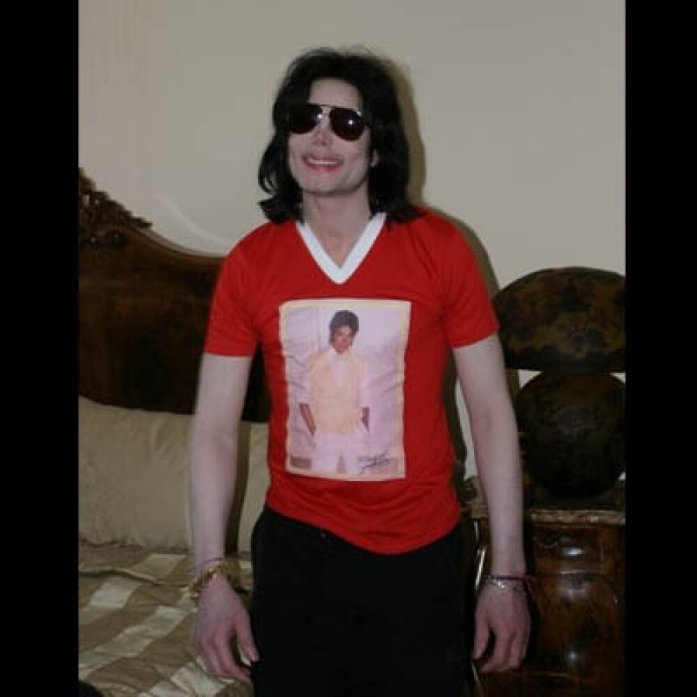 Poze rare cu Michael Jackson si copiii lui! - Imaginea 12