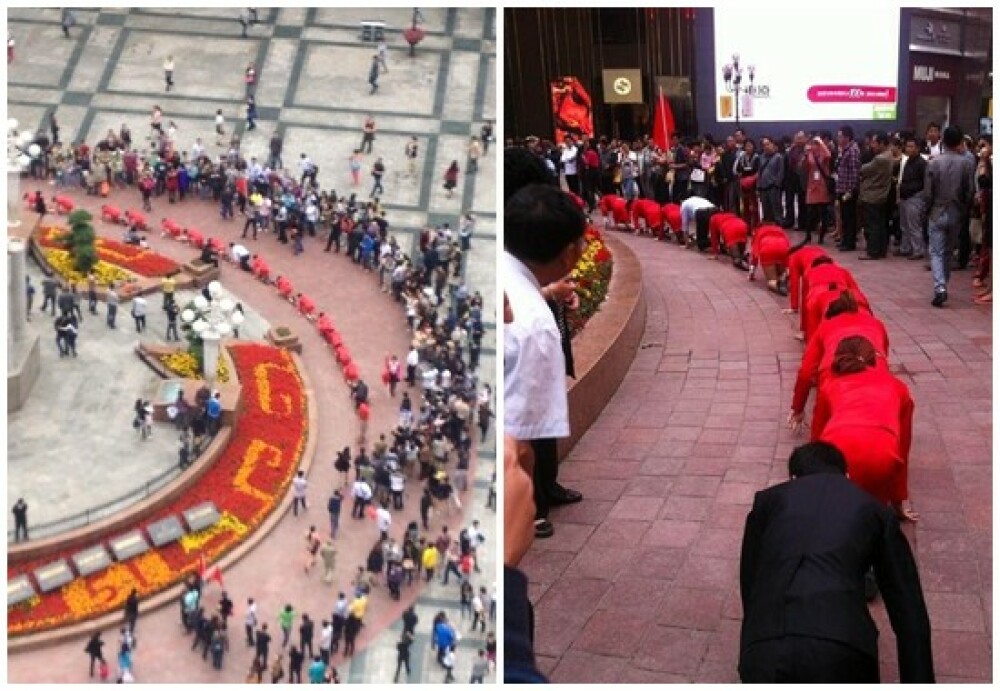 Angajatii unei firme din China, umiliti public in strada pentru a se obisnui cu stresul la munca - Imaginea 1