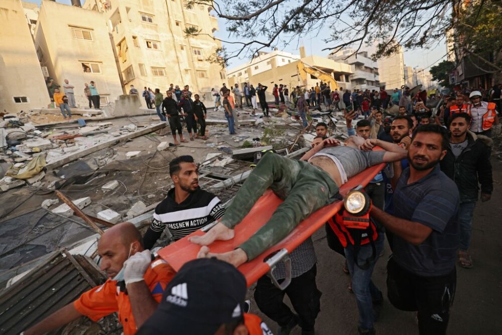 GALERIE FOTO. Imaginile dezastrului din Fâșia Gaza. Noi tiruri cu rachete duminică dimineață - Imaginea 11