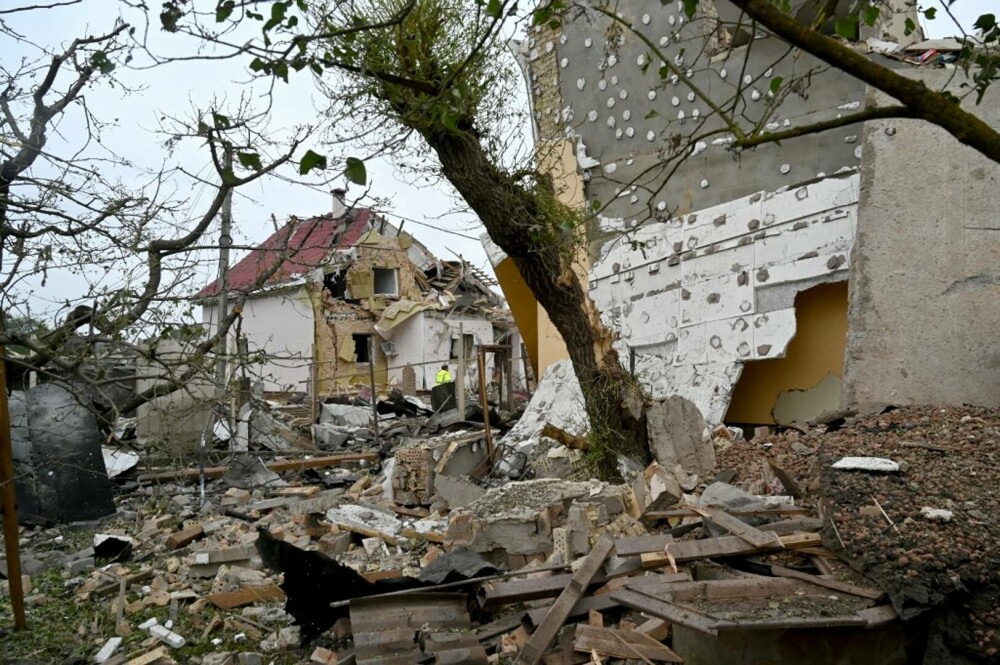 FOTO. Imagini de groază în Ucraina. Rusia a lovit peste 30 de orașe, în cel mai mare atac cu drone și rachete de până acum - Imaginea 11
