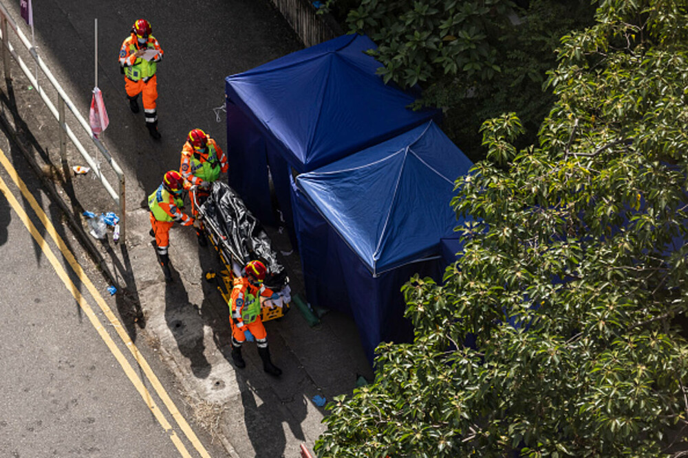 Nou bilanț al incendiului din Hong Kong: 151 de morți și 14 arestări. Unele cadavre ar putea să nu fie găsite niciodată - Imaginea 17