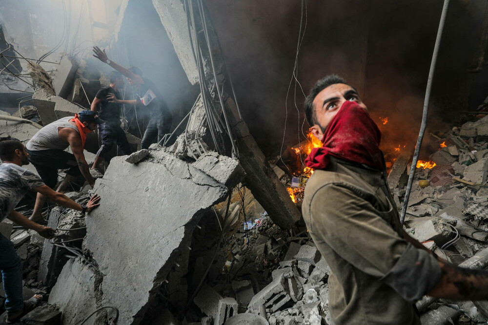 GALERIE FOTO. Cum arată Gaza după o săptămână de bombardamente ”de răzbunare” a Israelului, în urma atacului din 7 octombrie - Imaginea 11
