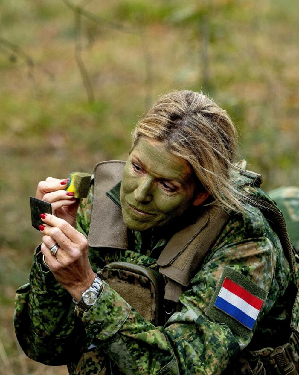 Regina Maxima a Țărilor de Jos, în uniformă militară și cu fața vopsită în culori de camuflaj. Ce s-a întâmplat | FOTO - Imaginea 18