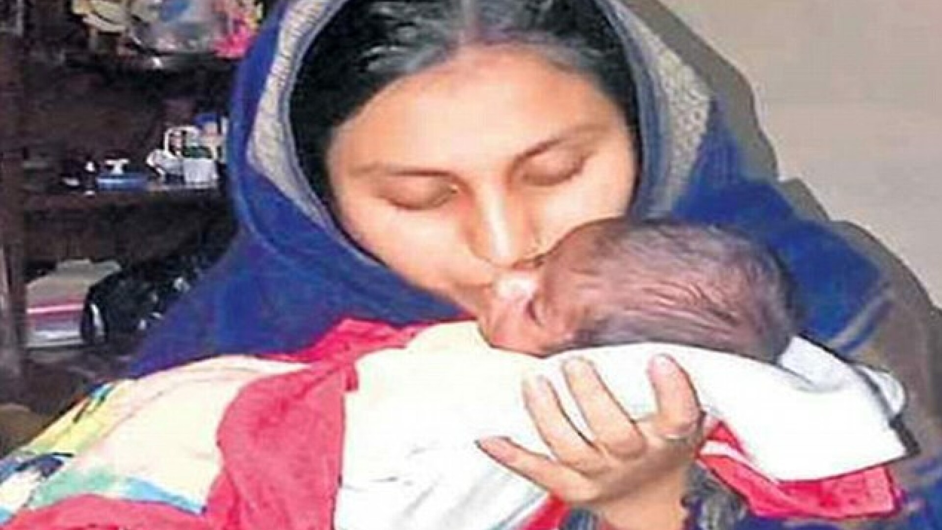 mama cu bebelus, India