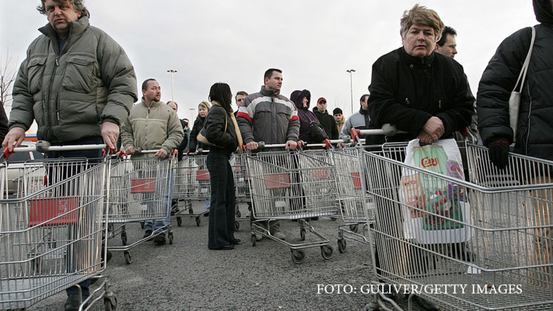 Shoppers wait to enter a Tesco hypermarket in Bratislava, Slovakia