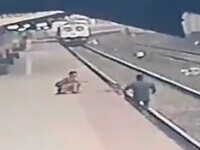 VIDEO. Imagini dramatice. Un copil a fost salvat de pe șinele de tren în ultima clipă