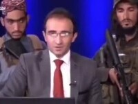 Talibani înarmați stau în spatele prezentatorilor TV, în Afganistan. Atacuri zilnice în Kabul