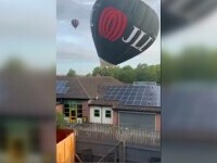 Momentul în care un balon cu aer cald era cât pe ce să se răstoarne, după ce s-a izbit de acoperișul unei școli. VIDEO