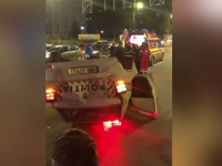 Autospecială de poliție, izbită în trafic și răsturnată, în Capitală. Trei polițiști au ajuns la spital