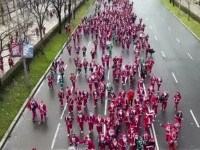 Peste 10.000 de alergători costumați în Moș Crăciun au luat startul la crosul caritabil din Madrid