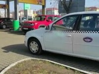 Taximetristă din Timișoara, lovită cu o sticlă de doi clienți nervoși