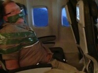 Barbat beat, imobilizat cu banda adeziva de pasageri, in timpul zborului. VIDEO