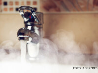 robinet la care curge apa calda FOTO SHUTTERSTOCK