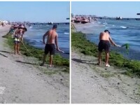Tânăr filmat în timp ce aruncă înapoi în apă algele de pe plajă, la Mamaia