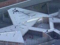 Mai mulți deținuți au incendiat o închisoare din Sydney și s-au urcat pe acoperiș