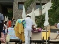 VIDEO VIRAL. Momentul în care angajații unui hotel ridică zeci de prosoape cu care oaspeții au rezervat șezlonguri la piscină