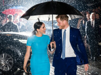 Imaginea cu Harry și Meghan în ploaie, sub umbrelă, a făcut înconjurul lumii