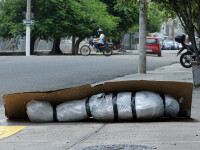 Sute de cadavre depozitate pe străzi sau pierdute în spitale și morgi într-un oraș din Ecuador. GALERIE FOTO - 3