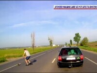 Momentul în care un șofer salvează o pisică pe cale să fie călcată de mașini, pe o șosea intens circulată
