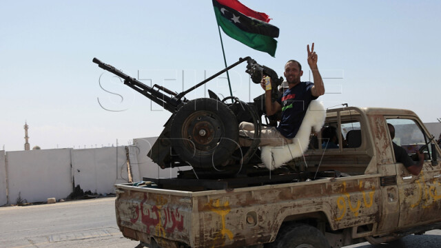 Galeria ororilor din Libia. Cele mai impresionante imagini din razboiul rebelilor cu Ghaddafi - Imaginea 8