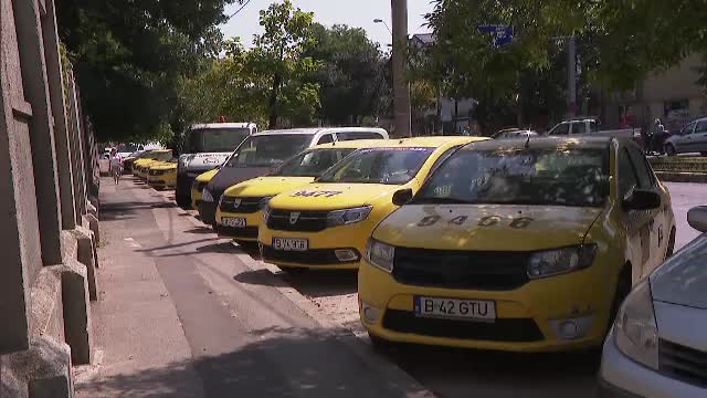 Zeci de taxiuri abandonate în Capitală. Cât câștigă șoferii care au plecat la ride-sharing