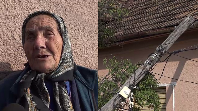 O femeie din Arad stă de aproape o săptămână cu un stâlp de telefonie căzut pe casă